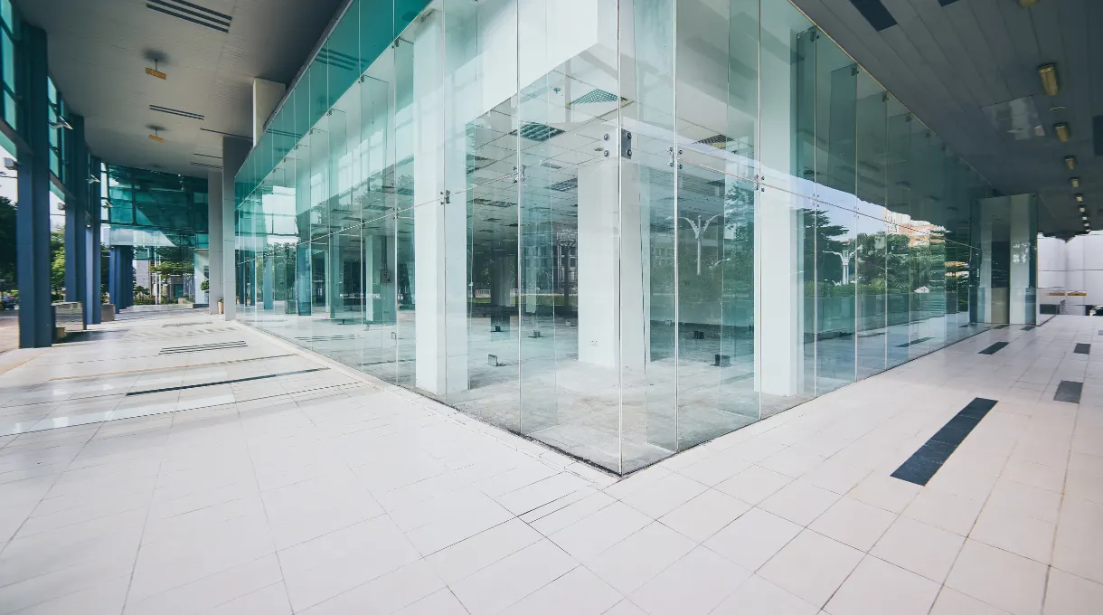 Modern commercial building exterior with a glass facade