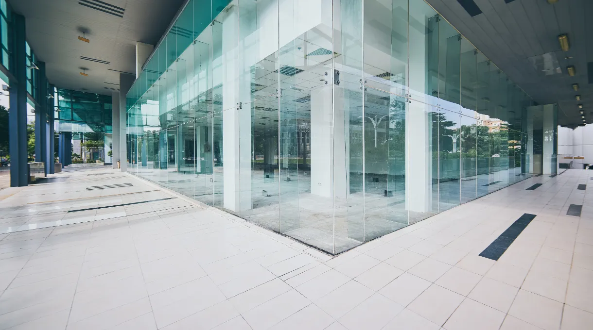 Modern commercial building exterior with a glass facade